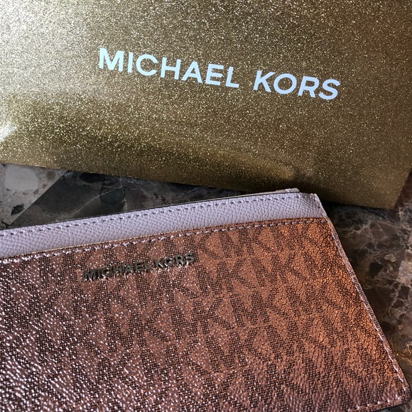 Michael Kors Handbags - NWOT Michael Kors rose gold wallet
